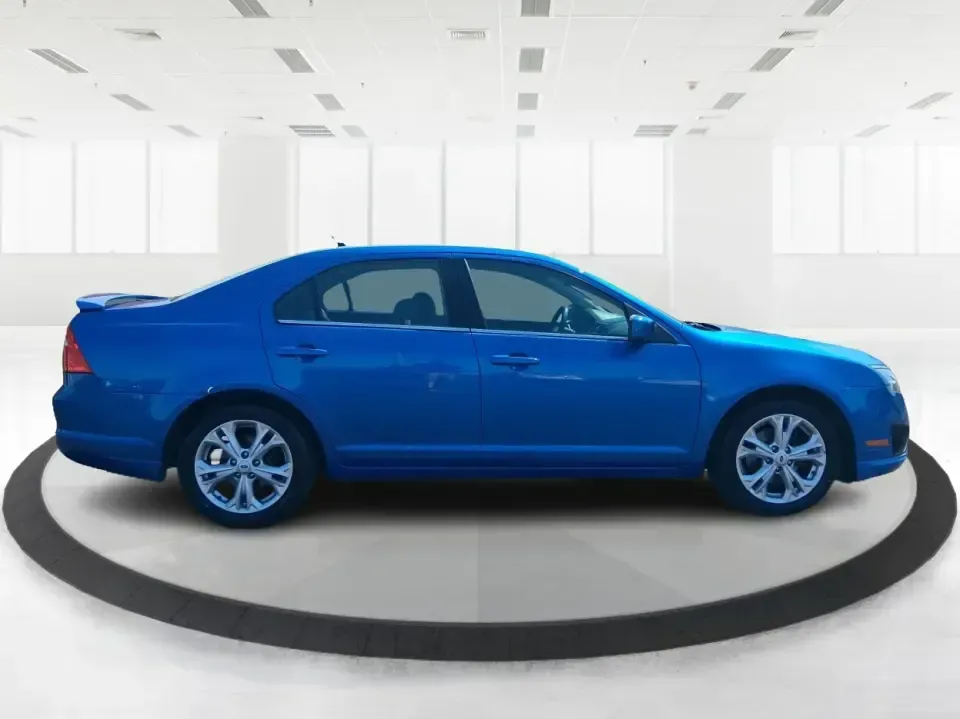 2012 Ford Fusion SE (3FAHP0HAXCR) with an 2.5L L4 DOHC 16V engine, located at 401 Woodman Dr, Riverside, OH, 45431, (937) 908-9800, 39.760899, -84.123421 - Need a dependable sedan that makes everyday life easier-whether you're commuting down I-75 to Dayton, running errands around Troy, or planning a weekend drive past the Miami River and downtown's shops and festivals? This 2012 Ford Fusion SE in Blue Flame Metallic is a smart, comfortable choice for b - Photo#1