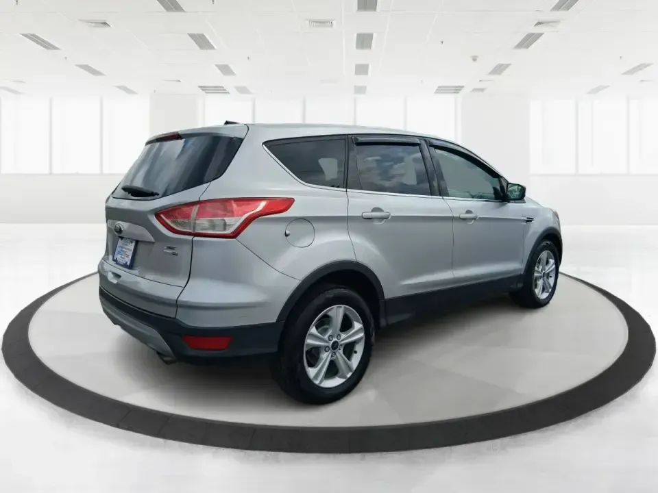 2015 Ford Escape SE (1FMCU9G91FU) with an 2.0L L4 DOHC 16V engine, 6-Speed Automatic transmission, located at 880 E. National Road, Vandalia, OH, 45377, (937) 908-9800, 39.891918, -84.183594 - Weekend getaways to Englewood MetroPark, snowy commutes down I75, and everyday school-and-grocery runs all feel easier when you've got an SUV that's sized right, confident in bad weather, and comfortable for the long haul. This **2015 Ford Escape SE 4WD** in **Ingot Silver** is a smart pick for driv - Photo#2