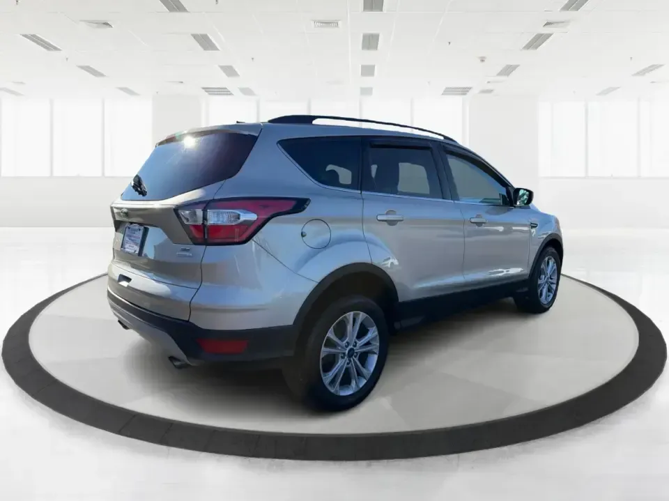 2018 Ford Escape SE FWD (1FMCU0GD6JU) with an 1.5L L4 DOHC 16V engine, 6A transmission, located at 1099 N County Rd 25A, Troy, OH, 45373, (937) 908-9800, 40.057079, -84.212883 - Weekday commute down I75, school drop-offs, and spontaneous weekend getaways to Charleston Falls Preserve all get easier in a compact SUV that fits real life. This 2018 Ford Escape SE FWD is a smart pick for Troy, Ohio drivers who want SUV versatility without the bulk-easy to park near downtown Troy- Photo#2
