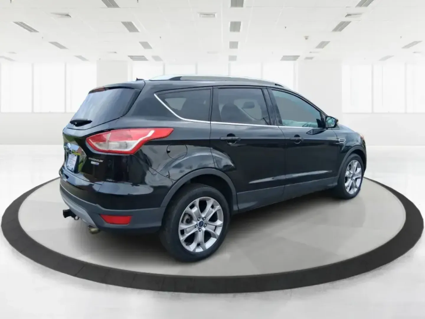 2014 Ford Escape Titanium (1FMCU9J99EU) with an 2.0L L4 DOHC 16V engine, 6-Speed Automatic transmission, located at 1099 N County Rd 25A, Troy, OH, 45373, (937) 908-9800, 40.057079, -84.212883 - Need one SUV that can handle an Ohio winter commute, school drop-offs, and a spontaneous weekend road trip to Hocking Hills without feeling like a compromise? This 2014 Ford Escape Titanium 4WD in sleek Tuxedo Black is built for real life in Troy-comfortable for long drives, confident in bad weather - Photo#2