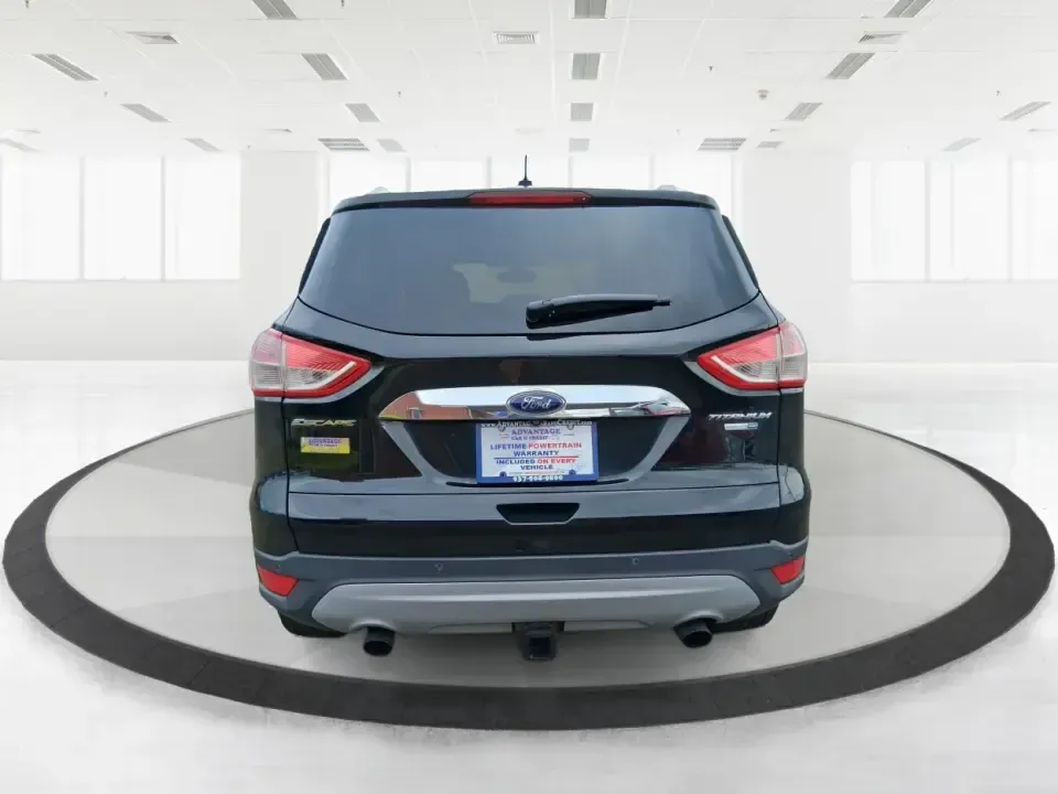 2014 Ford Escape Titanium (1FMCU9J99EU) with an 2.0L L4 DOHC 16V engine, 6-Speed Automatic transmission, located at 1099 N County Rd 25A, Troy, OH, 45373, (937) 908-9800, 40.057079, -84.212883 - Need one SUV that can handle an Ohio winter commute, school drop-offs, and a spontaneous weekend road trip to Hocking Hills without feeling like a compromise? This 2014 Ford Escape Titanium 4WD in sleek Tuxedo Black is built for real life in Troy-comfortable for long drives, confident in bad weather - Photo#3
