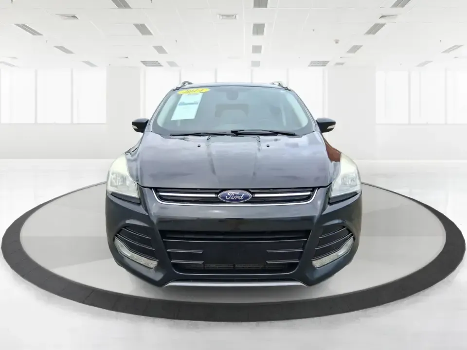 2014 Ford Escape Titanium (1FMCU9J99EU) with an 2.0L L4 DOHC 16V engine, 6-Speed Automatic transmission, located at 1099 N County Rd 25A, Troy, OH, 45373, (937) 908-9800, 40.057079, -84.212883 - Need one SUV that can handle an Ohio winter commute, school drop-offs, and a spontaneous weekend road trip to Hocking Hills without feeling like a compromise? This 2014 Ford Escape Titanium 4WD in sleek Tuxedo Black is built for real life in Troy-comfortable for long drives, confident in bad weather - Photo#7