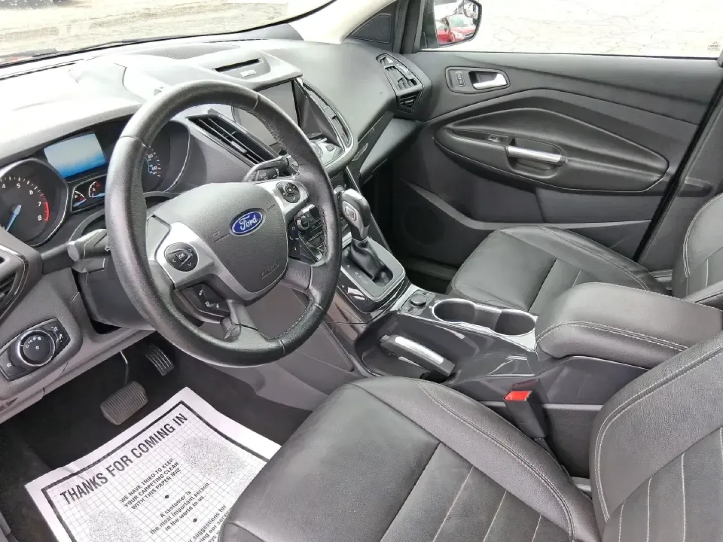 2014 Ford Escape Titanium (1FMCU9J99EU) with an 2.0L L4 DOHC 16V engine, 6-Speed Automatic transmission, located at 1099 N County Rd 25A, Troy, OH, 45373, (937) 908-9800, 40.057079, -84.212883 - Need one SUV that can handle an Ohio winter commute, school drop-offs, and a spontaneous weekend road trip to Hocking Hills without feeling like a compromise? This 2014 Ford Escape Titanium 4WD in sleek Tuxedo Black is built for real life in Troy-comfortable for long drives, confident in bad weather - Photo#9
