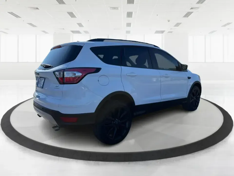 2017 Ford Escape SE (1FMCU0GD2HU) with an 1.5L L4 DOHC 16V engine, 6A transmission, located at 8750 N County Rd 25A, Piqua, OH, 45356, (937) 908-9800, 40.164391, -84.232513 - Picture a weekday that starts with a smooth commute up N County Rd 25A, turns into easy school drop-offs, and ends with a weekend escape to Indian Lake or a quick run down I75 for shopping and dinner-this 2017 Ford Escape SE is built for real life in and around Piqua, Ohio. Finished in standout Whit - Photo#2