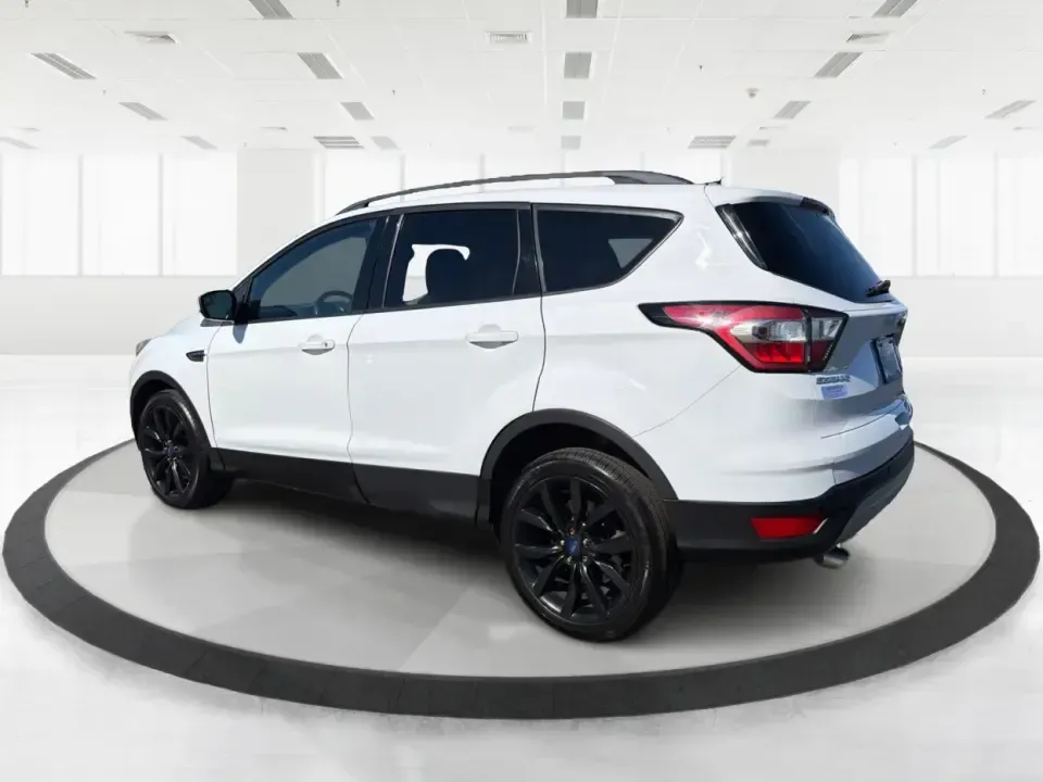 2017 Ford Escape SE (1FMCU0GD2HU) with an 1.5L L4 DOHC 16V engine, 6A transmission, located at 8750 N County Rd 25A, Piqua, OH, 45356, (937) 908-9800, 40.164391, -84.232513 - Picture a weekday that starts with a smooth commute up N County Rd 25A, turns into easy school drop-offs, and ends with a weekend escape to Indian Lake or a quick run down I75 for shopping and dinner-this 2017 Ford Escape SE is built for real life in and around Piqua, Ohio. Finished in standout Whit - Photo#4