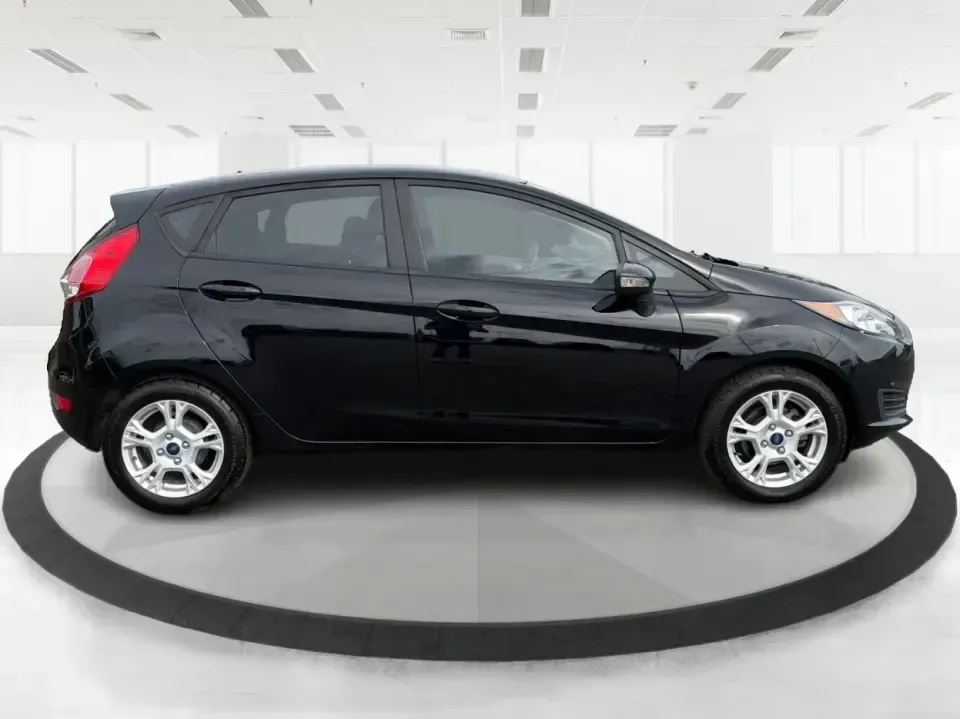 2016 Ford Fiesta SE (3FADP4EJ8GM) with an 1.6L L4 DOHC 16V engine, located at 8750 N County Rd 25A, Piqua, OH, 45356, (937) 908-9800, 40.164391, -84.232513 - Need a smart, easy-to-park hatchback that makes daily life simpler-whether you're commuting up I-75, running errands around downtown Piqua, or packing up for a weekend at Lock 9 Park? This 2016 Ford Fiesta SE Hatchback in Shadow Black delivers big practicality in a small, budget-friendly footprint, - Photo#1