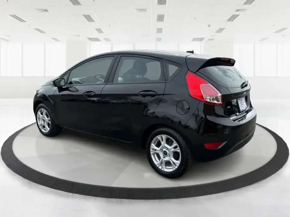 2016 Ford Fiesta SE (3FADP4EJ8GM) with an 1.6L L4 DOHC 16V engine, located at 8750 N County Rd 25A, Piqua, OH, 45356, (937) 908-9800, 40.164391, -84.232513 - Need a smart, easy-to-park hatchback that makes daily life simpler-whether you're commuting up I-75, running errands around downtown Piqua, or packing up for a weekend at Lock 9 Park? This 2016 Ford Fiesta SE Hatchback in Shadow Black delivers big practicality in a small, budget-friendly footprint, - Photo#4