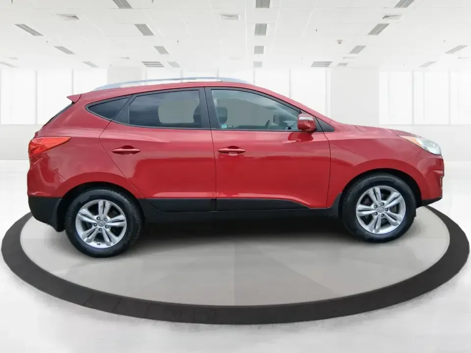 2013 Hyundai Tucson GLS (KM8JUCAC7DU) with an Theta II 2.4L I-4 DOHC engine, 6-Speed Automatic transmission, located at 1951 S Dayton Lakeview Rd., New Carlisle, OH, 45344, (937) 908-9800, 39.890999, -84.050255 - Need a dependable SUV that can handle Ohio weather, school drop-offs, and weekend getaways without stretching your budget? This 2013 Hyundai Tucson GLS in eye-catching Garnet Red is built for real life-comfortable for daily commuting, confident on slick winter roads, and practical for everything fro - Photo#1