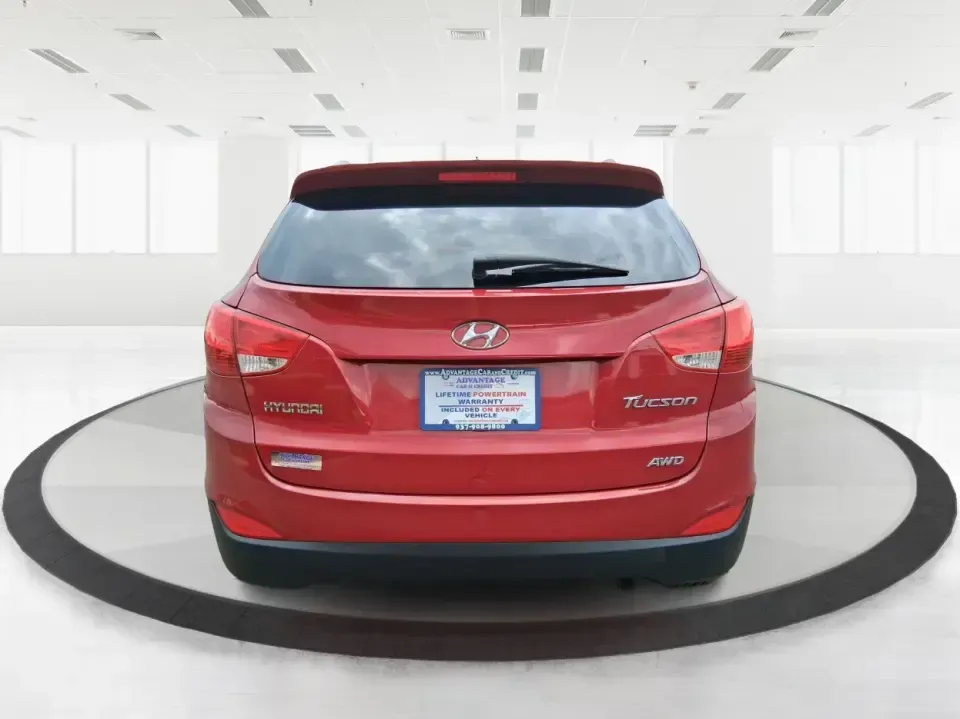 2013 Hyundai Tucson GLS (KM8JUCAC7DU) with an Theta II 2.4L I-4 DOHC engine, 6-Speed Automatic transmission, located at 8750 N County Rd 25A, Piqua, OH, 45356, (937) 908-9800, 40.164391, -84.232513 - Need a dependable SUV that can handle Ohio weather, school drop-offs, and weekend getaways without stretching your budget? This 2013 Hyundai Tucson GLS in eye-catching Garnet Red is built for real life-comfortable for daily commuting, confident on slick winter roads, and practical for everything fro - Photo#3