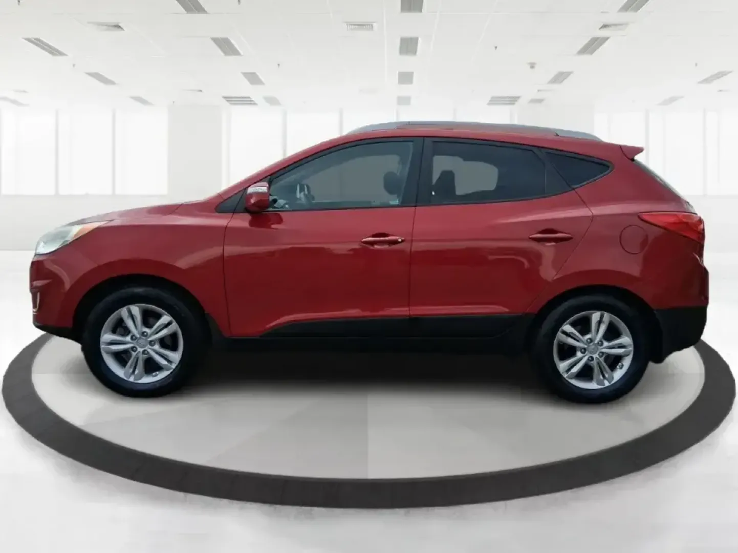 2013 Hyundai Tucson GLS (KM8JUCAC7DU) with an Theta II 2.4L I-4 DOHC engine, 6-Speed Automatic transmission, located at 8750 N County Rd 25A, Piqua, OH, 45356, (937) 908-9800, 40.164391, -84.232513 - Need a dependable SUV that can handle Ohio weather, school drop-offs, and weekend getaways without stretching your budget? This 2013 Hyundai Tucson GLS in eye-catching Garnet Red is built for real life-comfortable for daily commuting, confident on slick winter roads, and practical for everything fro - Photo#5