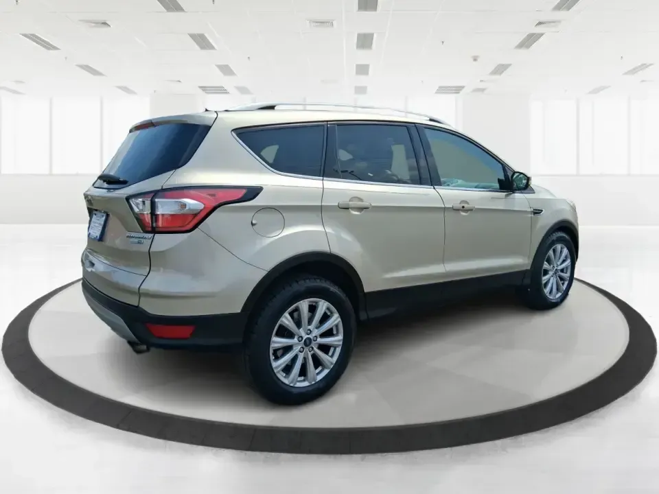 2017 Ford Escape Titanium (1FMCU9JD2HU) with an 1.5L L4 DOHC 16V engine, 6A transmission, located at 1230 East Main St, Xenia, OH, 45385, (937) 908-9800, 39.688026, -83.910172 - Whether you're a busy commuter running up and down US-35, a growing family juggling school drop-offs, or a weekend explorer heading out toward John Bryan State Park, this 2017 Ford Escape Titanium is the kind of compact SUV that fits real life in Xenia. With confident AWD capability, upscale comfort - Photo#2
