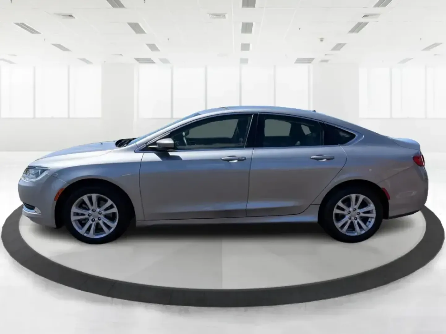 2016 Chrysler 200 Limited Platinum (1C3CCCABXGN) with an 2.4L L4 DOHC 16V engine, 9A transmission, located at 8750 N County Rd 25A, Piqua, OH, 45356, (937) 908-9800, 40.164391, -84.232513 - Picture your next weekday commute down I675 or a smooth evening drive past Wright State University-quiet cabin, premium touches, and the kind of comfort that makes errands, school drop-offs, and date nights feel effortless. This 2016 Chrysler 200 Limited Platinum in Billet Silver Metallic Clearcoat - Photo#5