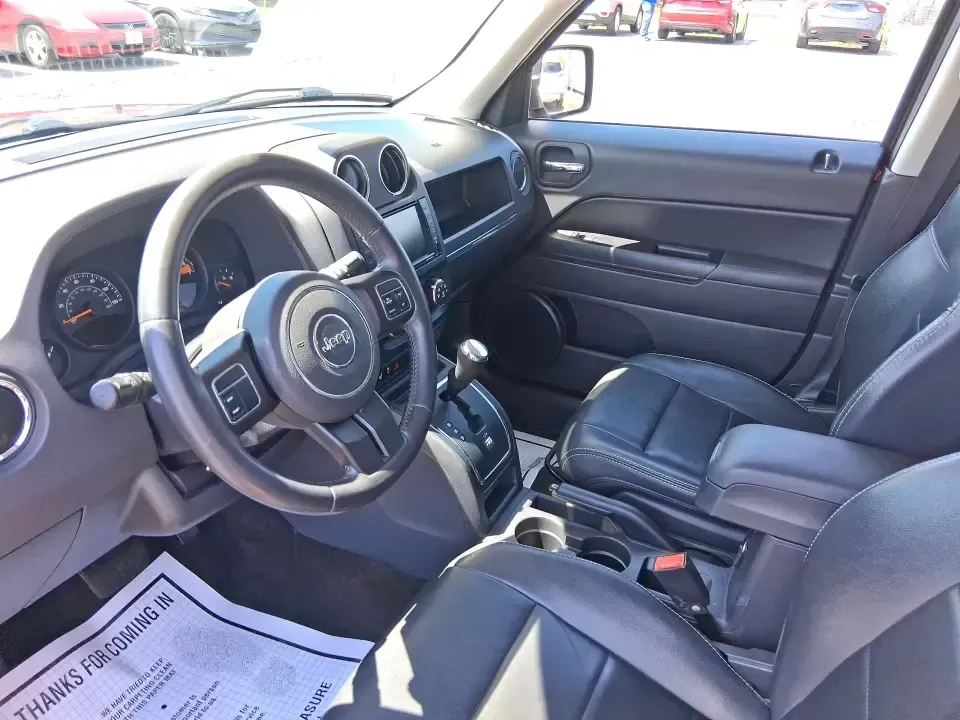 2015 Jeep Patriot High Altitude Edition (1C4NJRFB0FD) with an 2.4L I-4 DOHC engine, located at 1099 N County Rd 25A, Troy, OH, 45373, (937) 908-9800, 40.057079, -84.212883 - Picture your next Ohio weekend: loading up for a road trip to Hocking Hills, heading to a kids' tournament at Duke Park, or navigating winter backroads outside Troy with confidence. This **2015 Jeep Patriot High Altitude Edition** is the kind of SUV that fits real life-practical for daily errands, c - Photo#9
