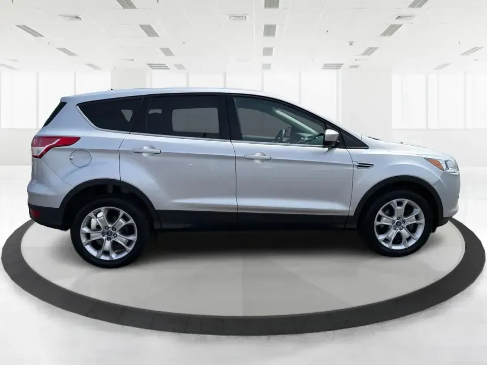 2015 Ford Escape SE (1FMCU9G98FU) with an 2.0L L4 DOHC 16V engine, 6-Speed Automatic transmission, located at 1099 N County Rd 25A, Troy, OH, 45373, (937) 908-9800, 40.057079, -84.212883 - Weekday commutes down I75, school drop-offs around Troy City Schools, and spontaneous weekend trips to Charleston Falls Preserve all get easier when you have an SUV that's the right size, the right power, and the right fit for your budget. This 2015 Ford Escape SE in Ingot Silver is built for real-l - Photo#1