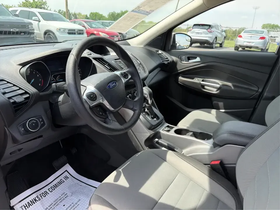 2015 Ford Escape SE (1FMCU9G98FU) with an 2.0L L4 DOHC 16V engine, 6-Speed Automatic transmission, located at 1099 N County Rd 25A, Troy, OH, 45373, (937) 908-9800, 40.057079, -84.212883 - Weekday commutes down I75, school drop-offs around Troy City Schools, and spontaneous weekend trips to Charleston Falls Preserve all get easier when you have an SUV that's the right size, the right power, and the right fit for your budget. This 2015 Ford Escape SE in Ingot Silver is built for real-l - Photo#9