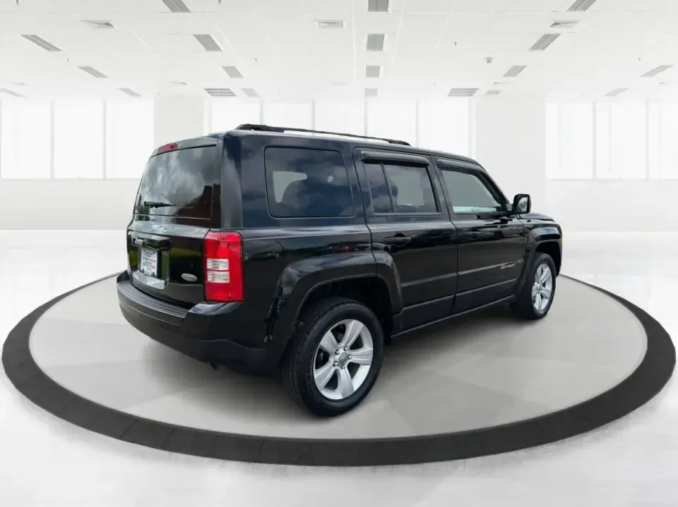 2014 Jeep Patriot Latitude (1C4NJRFB4ED) with an 2.4L I-4 DOHC engine, located at 8750 N County Rd 25A, Piqua, OH, 45356, (937) 908-9800, 40.164391, -84.232513 - Weekend adventures, winter commutes, and everyday errands feel a lot easier when you're in an SUV that's confident on Ohio backroads and comfortable in town. This **2014 Jeep Patriot Latitude 4WD** is a practical, go-anywhere choice for drivers who want Jeep capability without the full-size SUV foot - Photo#2