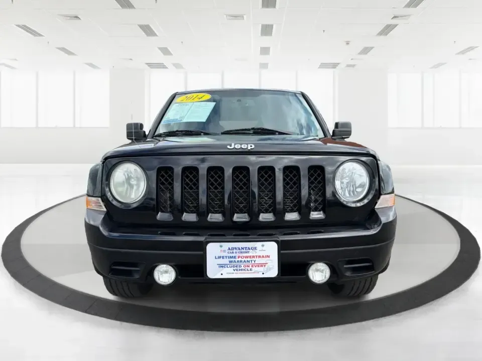 2014 Jeep Patriot Latitude (1C4NJRFB4ED) with an 2.4L I-4 DOHC engine, located at 8750 N County Rd 25A, Piqua, OH, 45356, (937) 908-9800, 40.164391, -84.232513 - Weekend adventures, winter commutes, and everyday errands feel a lot easier when you're in an SUV that's confident on Ohio backroads and comfortable in town. This **2014 Jeep Patriot Latitude 4WD** is a practical, go-anywhere choice for drivers who want Jeep capability without the full-size SUV foot - Photo#7