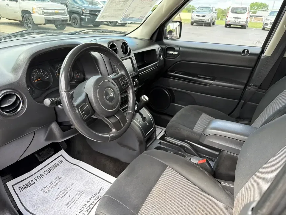 2014 Jeep Patriot Latitude (1C4NJRFB4ED) with an 2.4L I-4 DOHC engine, located at 8750 N County Rd 25A, Piqua, OH, 45356, (937) 908-9800, 40.164391, -84.232513 - Weekend adventures, winter commutes, and everyday errands feel a lot easier when you're in an SUV that's confident on Ohio backroads and comfortable in town. This **2014 Jeep Patriot Latitude 4WD** is a practical, go-anywhere choice for drivers who want Jeep capability without the full-size SUV foot - Photo#9