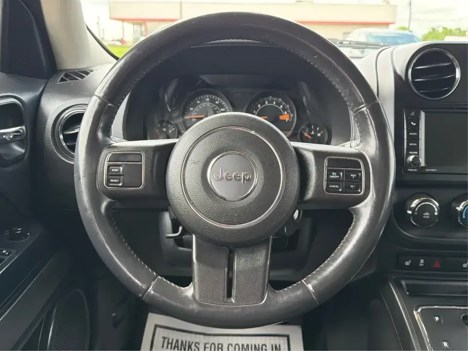 2014 Jeep Patriot Latitude (1C4NJRFB4ED) with an 2.4L I-4 DOHC engine, located at 8750 N County Rd 25A, Piqua, OH, 45356, (937) 908-9800, 40.164391, -84.232513 - Weekend adventures, winter commutes, and everyday errands feel a lot easier when you're in an SUV that's confident on Ohio backroads and comfortable in town. This **2014 Jeep Patriot Latitude 4WD** is a practical, go-anywhere choice for drivers who want Jeep capability without the full-size SUV foot - Photo#16