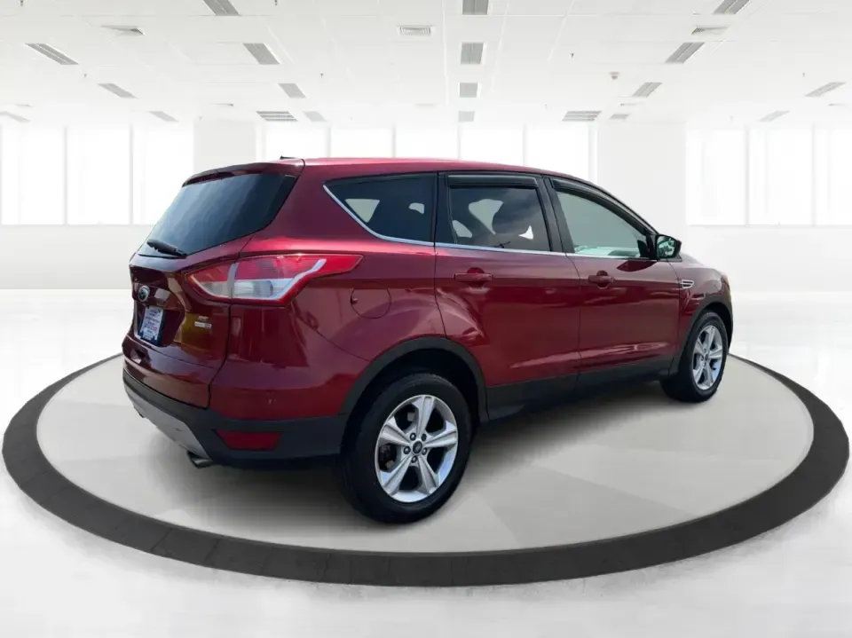 2014 Ford Escape SE (1FMCU9G9XEU) with an 2.0L L4 DOHC 16V engine, 6-Speed Automatic transmission, located at 4508 South Dixie Dr, Moraine, OH, 45439, (937) 908-9800, 39.689976, -84.218452 - Picture your next Ohio weekend: the kids loaded up for a day at Carillon Historical Park, a cooler in back for a picnic at Cox Arboretum, or a quick escape down I75 for a last-minute road trip-without worrying about whether your SUV can handle rain, slush, or a fully packed cargo area. This 2014 For - Photo#2