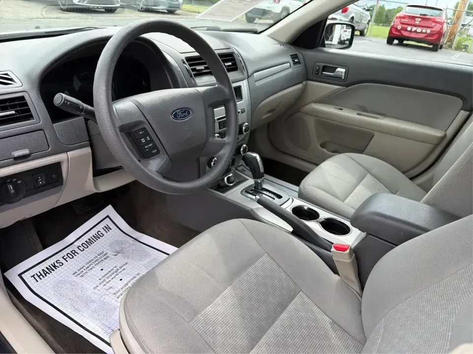 2012 Ford Fusion S (3FAHP0GA3CR) with an 2.5L I-4 DOHC engine, located at 1099 N County Rd 25A, Troy, OH, 45373, (937) 908-9800, 40.057079, -84.212883 - Need a dependable, budget-friendly sedan that can handle the weekday grind and still feel comfortable for weekend errands or a quick road trip to Dayton? This 2012 Ford Fusion S in sleek Tuxedo Black is a smart pick for commuters, first-time buyers, and growing families who want practical transporta - Photo#9