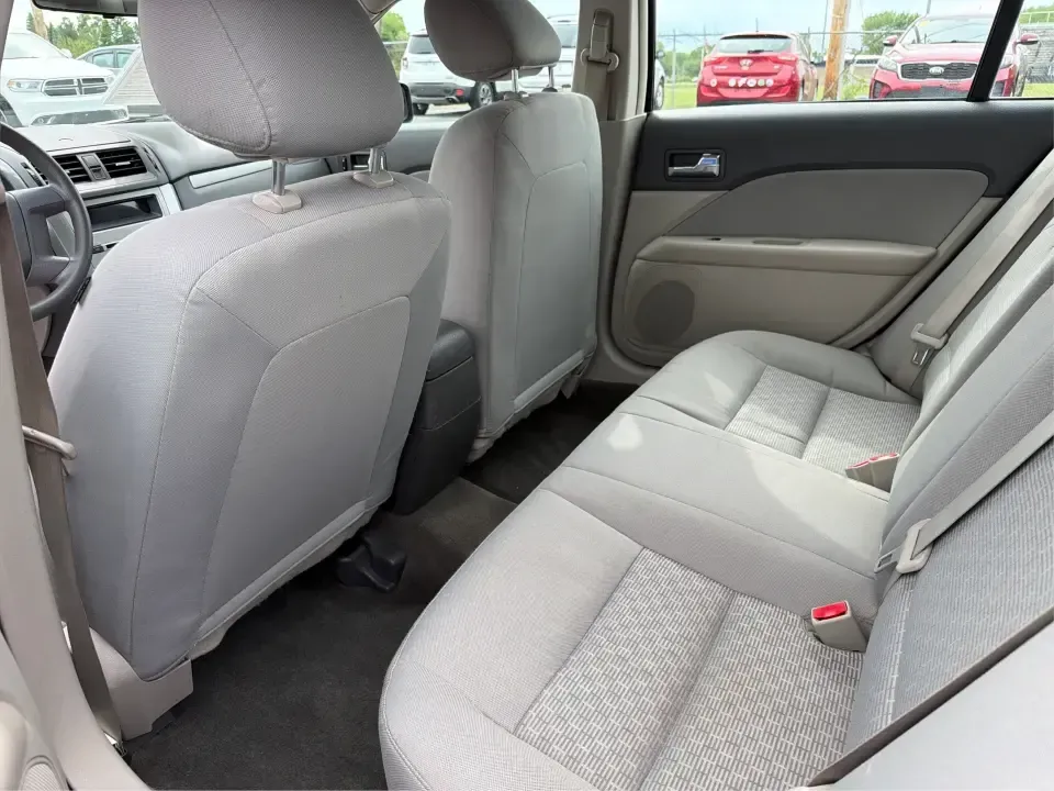 2012 Ford Fusion S (3FAHP0GA3CR) with an 2.5L I-4 DOHC engine, located at 1099 N County Rd 25A, Troy, OH, 45373, (937) 908-9800, 40.057079, -84.212883 - Need a dependable, budget-friendly sedan that can handle the weekday grind and still feel comfortable for weekend errands or a quick road trip to Dayton? This 2012 Ford Fusion S in sleek Tuxedo Black is a smart pick for commuters, first-time buyers, and growing families who want practical transporta - Photo#10
