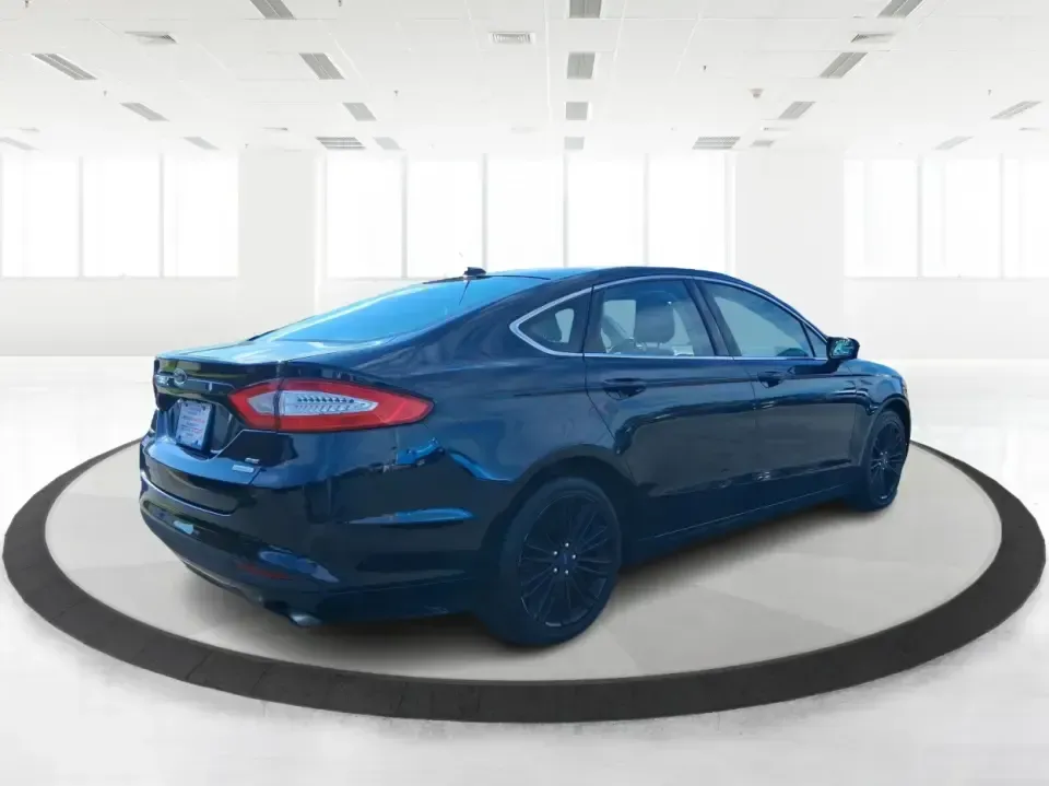2014 Ford Fusion SE (3FA6P0HD8ER) with an 1.5L L4 DOHC 16V engine, located at 1099 N County Rd 25A, Troy, OH, 45373, (937) 908-9800, 40.057079, -84.212883 - Need a dependable commuter that still feels comfortable for date night in Beavercreek, errands around Xenia Station, and weekend drives out toward Caesars Creek? This 2014 Ford Fusion SE is the kind of smart, budget-friendly sedan that fits real life-easy to park downtown, smooth on longer stretches - Photo#2