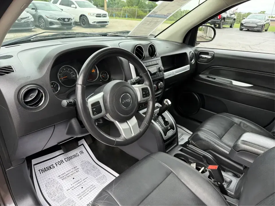 2016 Jeep Compass High Altitude Edition (1C4NJDEB2GD) with an 2.4L I-4 DOHC engine, 6A transmission, located at 8750 N County Rd 25A, Piqua, OH, 45356, (937) 908-9800, 40.164391, -84.232513 - Need a compact SUV that can handle Ohio weather, weekday commutes, and spontaneous weekend escapes without feeling bulky? This **2016 Jeep Compass High Altitude Edition 4WD** fits that lifestyle well-easy to park for errands around town, confident on wet back roads, and comfortable for longer drives - Photo#9