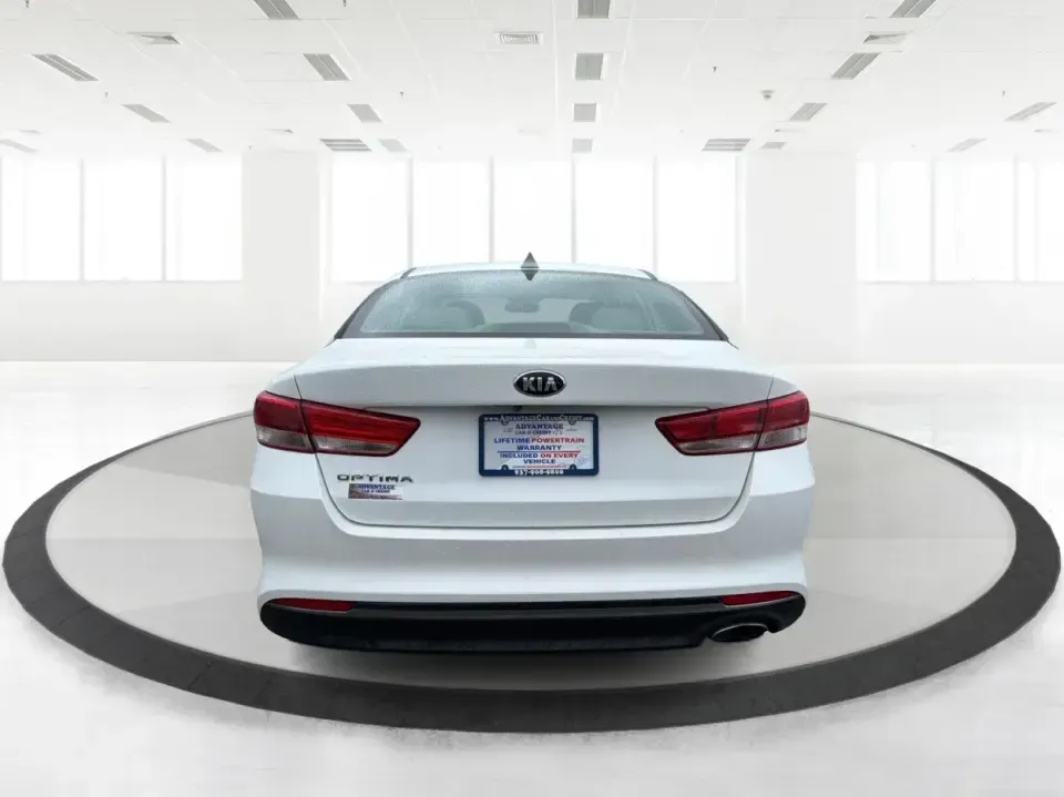 2016 Kia Optima LX (KNAGT4L36G5) with an Theta II 2.4L I-4 gasoline direct injection engine, 6A transmission, located at 401 Woodman Dr, Riverside, OH, 45431, (937) 908-9800, 39.760899, -84.123421 - Need a dependable sedan that can handle the weekday commute down I-675, quick school drop-offs near Mad River, and an easy weekend drive to Carillon Historical Park or a Dayton Dragons game? This 2016 Kia Optima LX in Snow White Pearl delivers the kind of practical comfort and modern tech that fits - Photo#3