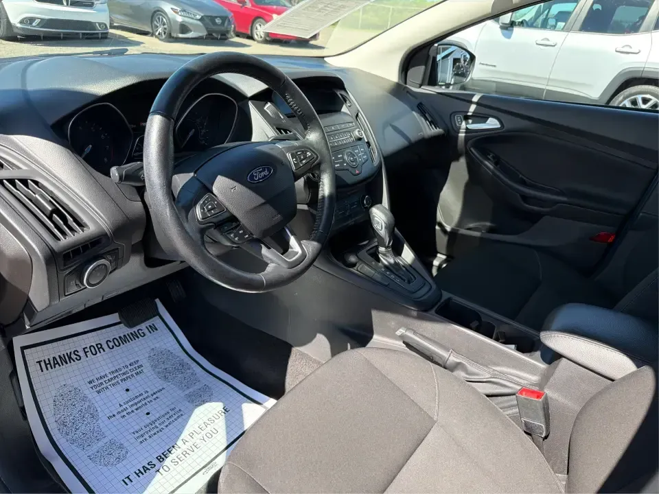 2018 Ford Focus SE (1FADP3F22JL) with an 2.0L L4 DOHC 16V engine, Automatic transmission, located at 4508 South Dixie Dr, Moraine, OH, 45439, (937) 908-9800, 39.689976, -84.218452 - Need a smart, efficient sedan for daily commutes down South Dixie Drive, quick runs to the Moraine Walmart area, or a reliable ride for work in Dayton and back? This 2018 Ford Focus SE is built for real life-easy to park, comfortable for longer drives, and fuel-friendly for the weekly grind. Finishe - Photo#9