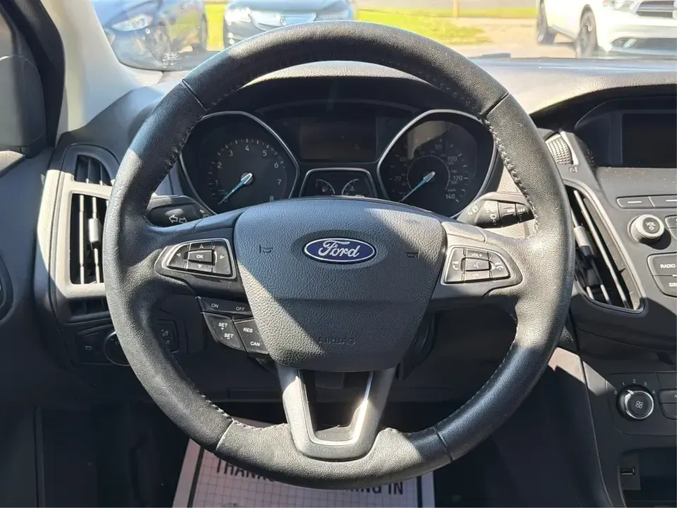 2018 Ford Focus SE (1FADP3F22JL) with an 2.0L L4 DOHC 16V engine, Automatic transmission, located at 4508 South Dixie Dr, Moraine, OH, 45439, (937) 908-9800, 39.689976, -84.218452 - Need a smart, efficient sedan for daily commutes down South Dixie Drive, quick runs to the Moraine Walmart area, or a reliable ride for work in Dayton and back? This 2018 Ford Focus SE is built for real life-easy to park, comfortable for longer drives, and fuel-friendly for the weekly grind. Finishe - Photo#16