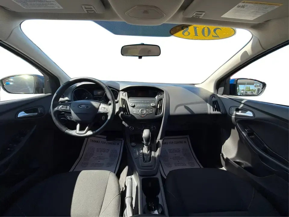 2018 Ford Focus SE (1FADP3F22JL) with an 2.0L L4 DOHC 16V engine, Automatic transmission, located at 4508 South Dixie Dr, Moraine, OH, 45439, (937) 908-9800, 39.689976, -84.218452 - Need a smart, efficient sedan for daily commutes down South Dixie Drive, quick runs to the Moraine Walmart area, or a reliable ride for work in Dayton and back? This 2018 Ford Focus SE is built for real life-easy to park, comfortable for longer drives, and fuel-friendly for the weekly grind. Finishe - Photo#21