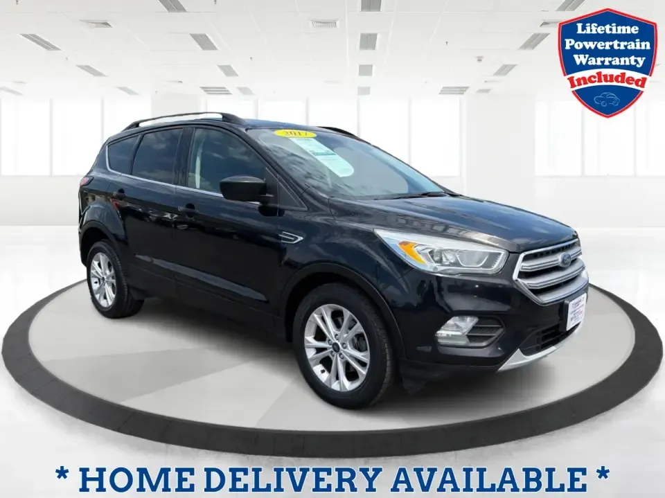 2017 Ford Escape SE (1FMCU0GD1HU) with an 1.5L L4 DOHC 16V engine, 6A transmission, located at 880 E. National Road, Vandalia, OH, 45377, (937) 908-9800, 39.891918, -84.183594 - Need a compact SUV that can handle the weekday commute on I75, school drop-offs around Troy, and spontaneous weekend getaways to Charleston Falls Preserve or a quick stroll through the Troy Strawberry Festival? This 2017 Ford Escape SE in Shadow Black is a practical, easy-to-live-with choice for bus - Photo#0