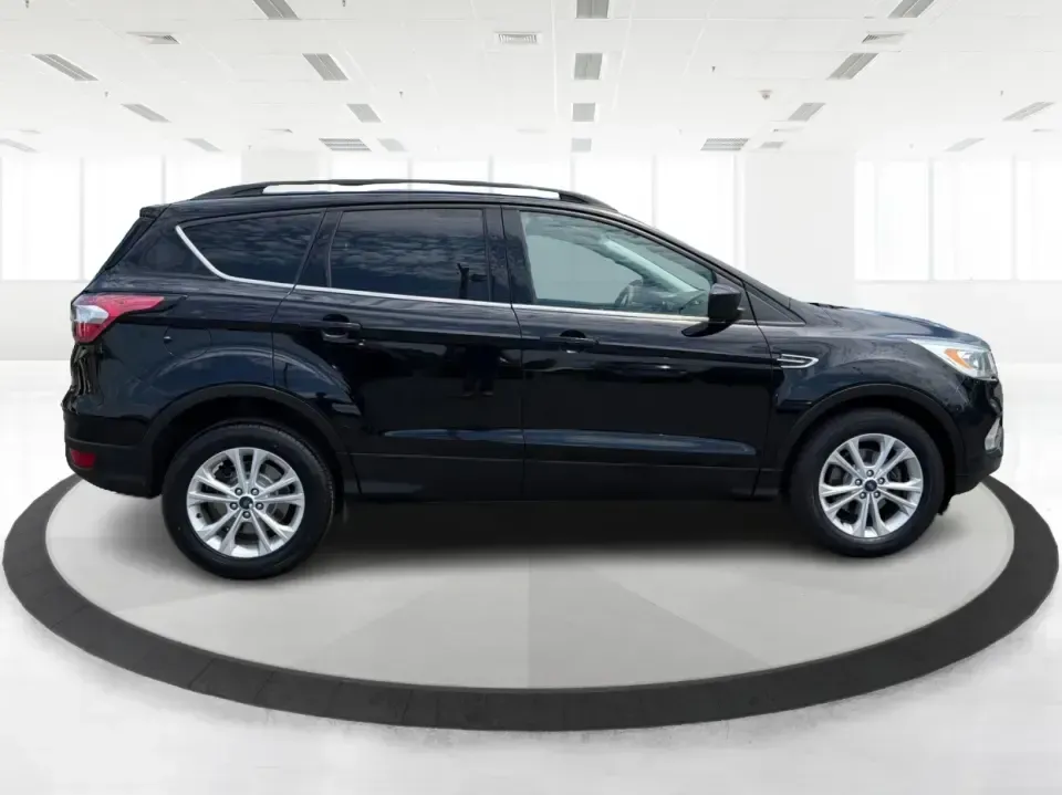 2017 Ford Escape SE (1FMCU0GD1HU) with an 1.5L L4 DOHC 16V engine, 6A transmission, located at 880 E. National Road, Vandalia, OH, 45377, (937) 908-9800, 39.891918, -84.183594 - Need a compact SUV that can handle the weekday commute on I75, school drop-offs around Troy, and spontaneous weekend getaways to Charleston Falls Preserve or a quick stroll through the Troy Strawberry Festival? This 2017 Ford Escape SE in Shadow Black is a practical, easy-to-live-with choice for bus - Photo#1