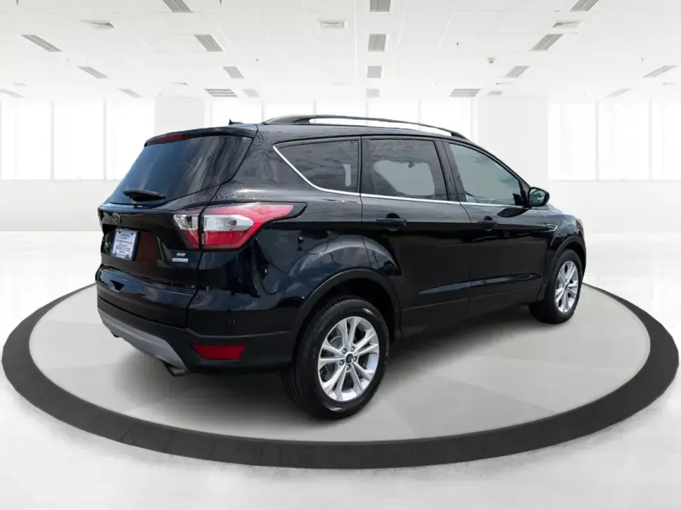 2017 Ford Escape SE (1FMCU0GD1HU) with an 1.5L L4 DOHC 16V engine, 6A transmission, located at 880 E. National Road, Vandalia, OH, 45377, (937) 908-9800, 39.891918, -84.183594 - Need a compact SUV that can handle the weekday commute on I75, school drop-offs around Troy, and spontaneous weekend getaways to Charleston Falls Preserve or a quick stroll through the Troy Strawberry Festival? This 2017 Ford Escape SE in Shadow Black is a practical, easy-to-live-with choice for bus - Photo#2