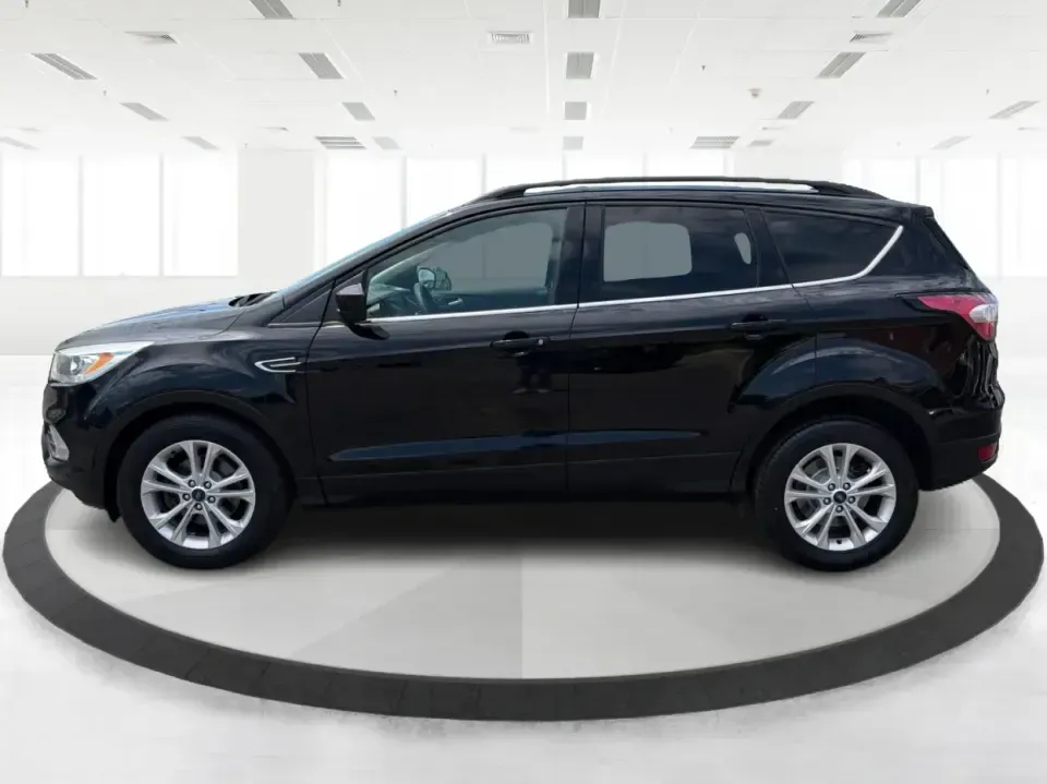 2017 Ford Escape SE (1FMCU0GD1HU) with an 1.5L L4 DOHC 16V engine, 6A transmission, located at 880 E. National Road, Vandalia, OH, 45377, (937) 908-9800, 39.891918, -84.183594 - Need a compact SUV that can handle the weekday commute on I75, school drop-offs around Troy, and spontaneous weekend getaways to Charleston Falls Preserve or a quick stroll through the Troy Strawberry Festival? This 2017 Ford Escape SE in Shadow Black is a practical, easy-to-live-with choice for bus - Photo#5