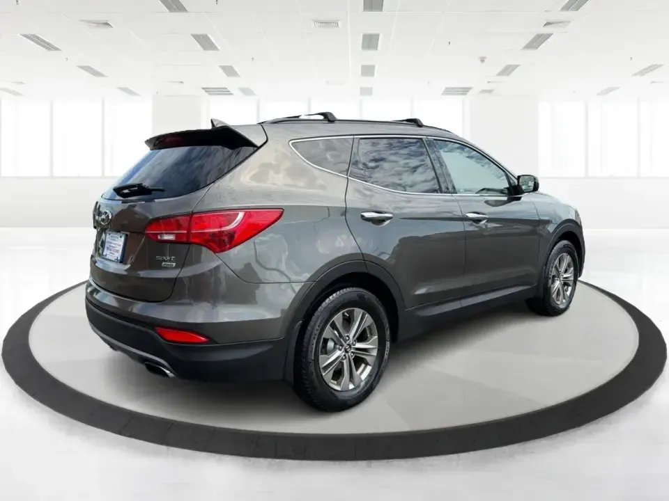 2014 Hyundai Santa Fe 2.4L (5XYZUDLB0EG) with an Theta II 2.4L I-4 gasoline direct injection engine, 6-Speed Automatic transmission, located at 4508 South Dixie Dr, Moraine, OH, 45439, (937) 908-9800, 39.689976, -84.218452 - Weekend road trips to Carillon Historical Park, snowy school-drop mornings, and everyday commuting down I75 or South Dixie Drive feel a lot easier when you've got a roomy SUV with confident traction and family-friendly comfort. This **2014 Hyundai Santa Fe 2.4L** in eye-catching **Cabo Bronze** is b - Photo#2
