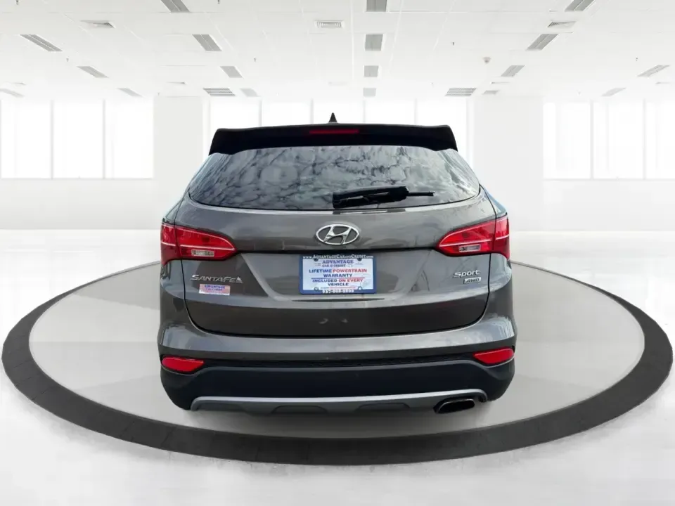 2014 Hyundai Santa Fe 2.4L (5XYZUDLB0EG) with an Theta II 2.4L I-4 gasoline direct injection engine, 6-Speed Automatic transmission, located at 4508 South Dixie Dr, Moraine, OH, 45439, (937) 908-9800, 39.689976, -84.218452 - Weekend road trips to Carillon Historical Park, snowy school-drop mornings, and everyday commuting down I75 or South Dixie Drive feel a lot easier when you've got a roomy SUV with confident traction and family-friendly comfort. This **2014 Hyundai Santa Fe 2.4L** in eye-catching **Cabo Bronze** is b - Photo#3