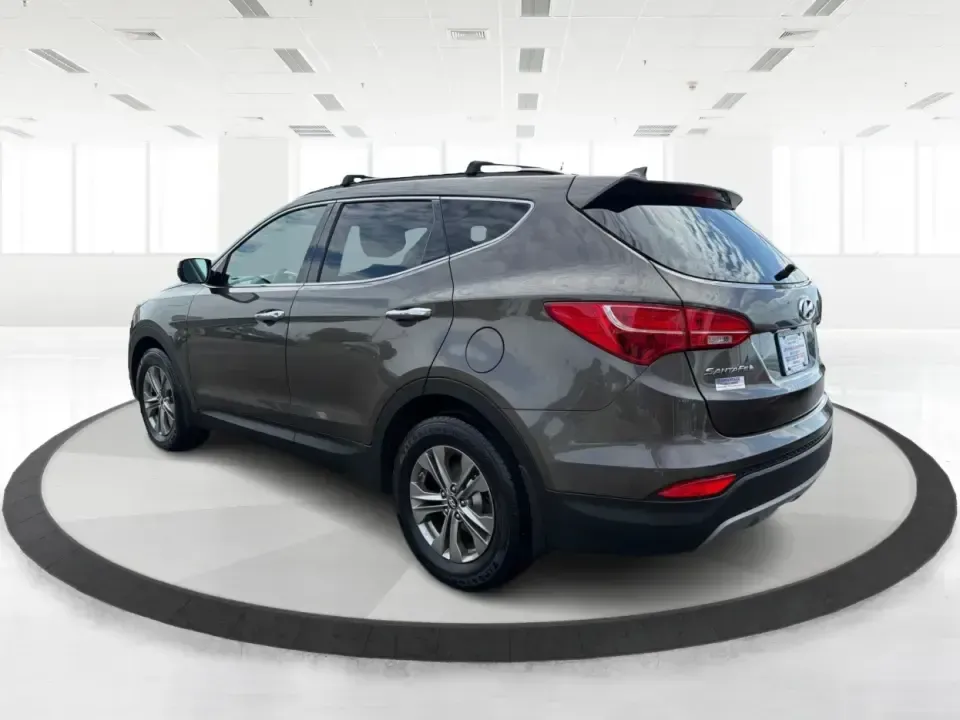 2014 Hyundai Santa Fe 2.4L (5XYZUDLB0EG) with an Theta II 2.4L I-4 gasoline direct injection engine, 6-Speed Automatic transmission, located at 4508 South Dixie Dr, Moraine, OH, 45439, (937) 908-9800, 39.689976, -84.218452 - Weekend road trips to Carillon Historical Park, snowy school-drop mornings, and everyday commuting down I75 or South Dixie Drive feel a lot easier when you've got a roomy SUV with confident traction and family-friendly comfort. This **2014 Hyundai Santa Fe 2.4L** in eye-catching **Cabo Bronze** is b - Photo#4