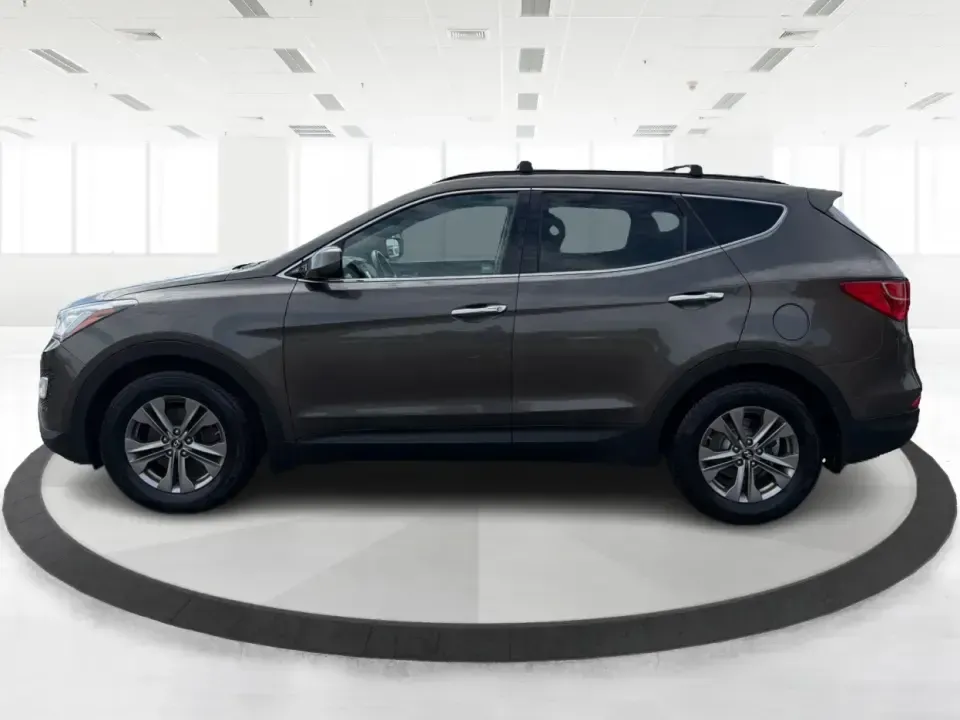 2014 Hyundai Santa Fe 2.4L (5XYZUDLB0EG) with an Theta II 2.4L I-4 gasoline direct injection engine, 6-Speed Automatic transmission, located at 4508 South Dixie Dr, Moraine, OH, 45439, (937) 908-9800, 39.689976, -84.218452 - Weekend road trips to Carillon Historical Park, snowy school-drop mornings, and everyday commuting down I75 or South Dixie Drive feel a lot easier when you've got a roomy SUV with confident traction and family-friendly comfort. This **2014 Hyundai Santa Fe 2.4L** in eye-catching **Cabo Bronze** is b - Photo#5