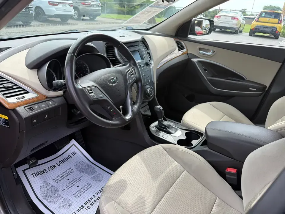 2014 Hyundai Santa Fe 2.4L (5XYZUDLB0EG) with an Theta II 2.4L I-4 gasoline direct injection engine, 6-Speed Automatic transmission, located at 4508 South Dixie Dr, Moraine, OH, 45439, (937) 908-9800, 39.689976, -84.218452 - Weekend road trips to Carillon Historical Park, snowy school-drop mornings, and everyday commuting down I75 or South Dixie Drive feel a lot easier when you've got a roomy SUV with confident traction and family-friendly comfort. This **2014 Hyundai Santa Fe 2.4L** in eye-catching **Cabo Bronze** is b - Photo#9