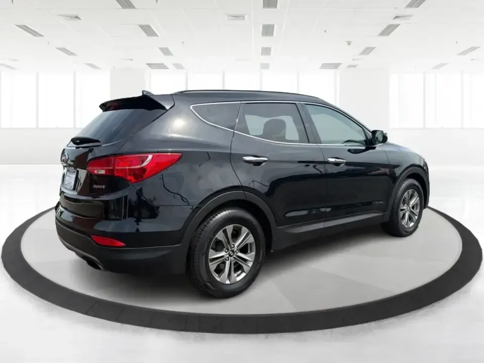 2016 Hyundai Santa Fe 2.4L (5XYZU3LB5GG) with an Theta II 2.4L I-4 gasoline direct injection engine, 6-Speed Automatic transmission, located at 1230 East Main St, Xenia, OH, 45385, (937) 908-9800, 39.688026, -83.910172 - Road-trip ready for Hocking Hills weekends, school-run practical for busy mornings, and comfortable enough for the daily commute down US-35-this 2016 Hyundai Santa Fe 2.4L is the kind of SUV that fits real life in and around Xenia, Ohio. Finished in Twilight Black, it delivers a confident, versatile - Photo#2