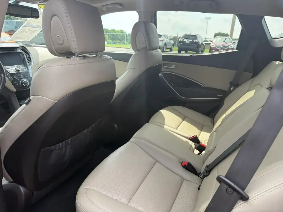 2016 Hyundai Santa Fe 2.4L (5XYZU3LB5GG) with an Theta II 2.4L I-4 gasoline direct injection engine, 6-Speed Automatic transmission, located at 1230 East Main St, Xenia, OH, 45385, (937) 908-9800, 39.688026, -83.910172 - Road-trip ready for Hocking Hills weekends, school-run practical for busy mornings, and comfortable enough for the daily commute down US-35-this 2016 Hyundai Santa Fe 2.4L is the kind of SUV that fits real life in and around Xenia, Ohio. Finished in Twilight Black, it delivers a confident, versatile - Photo#10
