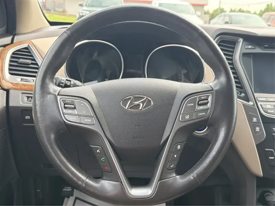 2016 Hyundai Santa Fe 2.4L (5XYZU3LB5GG) with an Theta II 2.4L I-4 gasoline direct injection engine, 6-Speed Automatic transmission, located at 1230 East Main St, Xenia, OH, 45385, (937) 908-9800, 39.688026, -83.910172 - Road-trip ready for Hocking Hills weekends, school-run practical for busy mornings, and comfortable enough for the daily commute down US-35-this 2016 Hyundai Santa Fe 2.4L is the kind of SUV that fits real life in and around Xenia, Ohio. Finished in Twilight Black, it delivers a confident, versatile - Photo#16