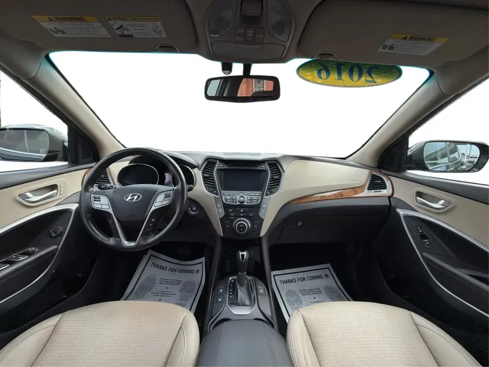 2016 Hyundai Santa Fe 2.4L (5XYZU3LB5GG) with an Theta II 2.4L I-4 gasoline direct injection engine, 6-Speed Automatic transmission, located at 1230 East Main St, Xenia, OH, 45385, (937) 908-9800, 39.688026, -83.910172 - Road-trip ready for Hocking Hills weekends, school-run practical for busy mornings, and comfortable enough for the daily commute down US-35-this 2016 Hyundai Santa Fe 2.4L is the kind of SUV that fits real life in and around Xenia, Ohio. Finished in Twilight Black, it delivers a confident, versatile - Photo#22
