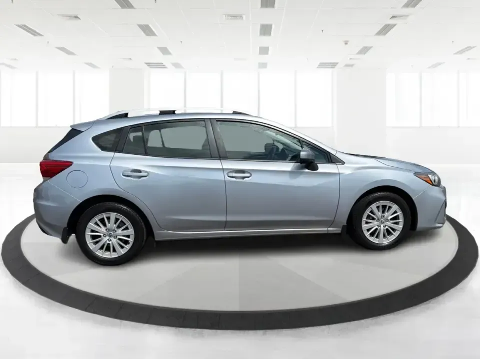 2017 Subaru Impreza 2.0i Premium (4S3GTAD62H3) with an 2L H-4 gasoline direct injection engine, CVT transmission, located at 1951 S Dayton Lakeview Rd., New Carlisle, OH, 45344, (937) 908-9800, 39.890999, -84.050255 - Picture a weekday commute from New Carlisle to Dayton, then a spontaneous weekend loop out toward Springfield-one vehicle that fits both lifestyles without feeling bulky or hard to park. This 2017 Subaru Impreza 2.0i Premium Hatchback in Ice Silver Metallic is a smart match for drivers who want year - Photo#1