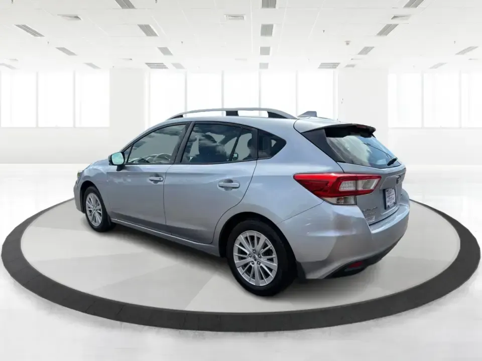 2017 Subaru Impreza 2.0i Premium (4S3GTAD62H3) with an 2L H-4 gasoline direct injection engine, CVT transmission, located at 1951 S Dayton Lakeview Rd., New Carlisle, OH, 45344, (937) 908-9800, 39.890999, -84.050255 - Picture a weekday commute from New Carlisle to Dayton, then a spontaneous weekend loop out toward Springfield-one vehicle that fits both lifestyles without feeling bulky or hard to park. This 2017 Subaru Impreza 2.0i Premium Hatchback in Ice Silver Metallic is a smart match for drivers who want year - Photo#4