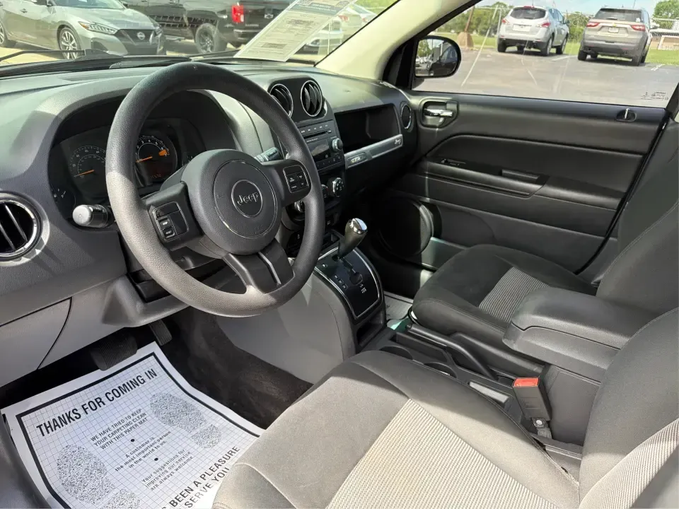 2015 Jeep Compass Sport FWD (1C4NJCBA6FD) with an 2.0L L4 DOHC 16V engine, located at 880 E. National Road, Vandalia, OH, 45377, (937) 908-9800, 39.891918, -84.183594 - Weekday commutes down I75, school drop-offs in Butler Township, and quick weekend getaways to the National Museum of the U.S. Air Force or Taylorsville MetroPark all call for an SUV that's easy to live with, comfortable for five, and efficient enough to keep your budget in check. This **2015 Jeep Co - Photo#9