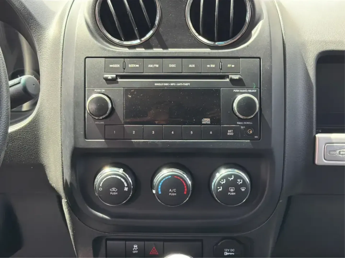 2015 Jeep Compass Sport FWD (1C4NJCBA6FD) with an 2.0L L4 DOHC 16V engine, located at 1951 S Dayton Lakeview Rd., New Carlisle, OH, 45344, (937) 908-9800, 39.890999, -84.050255 - Whether your week looks like a daily commute down I70, school drop-offs around Clark County, or a quick weekend escape to Buck Creek State Park, this **2015 Jeep Compass Sport FWD** is the kind of compact SUV that fits real life. With seating for **five**, easy-to-park sizing, and the versatile carg- Photo#13