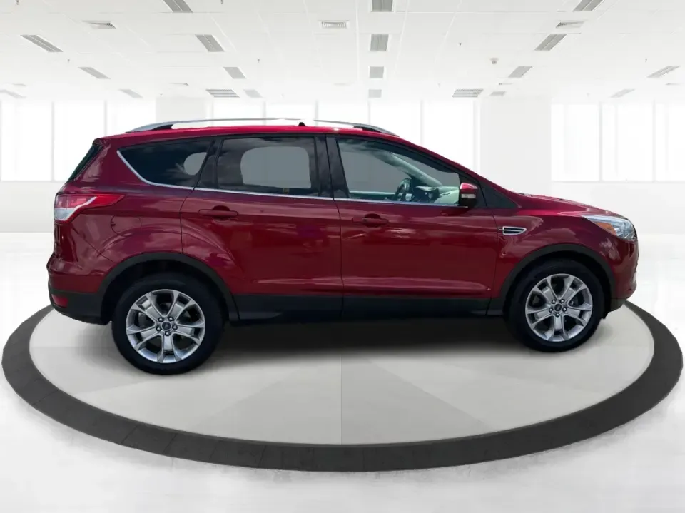 2014 Ford Escape Titanium 4WD (1FMCU9J91EU) with an 2.0L L4 DOHC 16V engine, 6-Speed Automatic transmission, located at 1099 N County Rd 25A, Troy, OH, 45373, (937) 908-9800, 40.057079, -84.212883 - Weekend getaways to Hocking Hills, snowy commutes up I75, or the everyday school-and-grocery loop around Troy-this 2014 Ford Escape Titanium 4WD is built for the kind of life that doesn't slow down when the weather changes. With seating for five, flexible cargo space, and confident four-wheel drive,- Photo#1